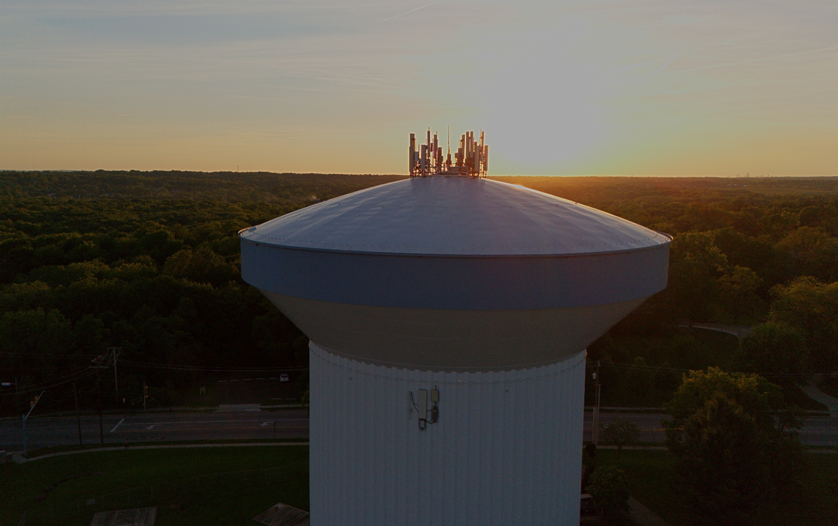 Drone photograph of a municipal water tower at golden hour, Northeast Ohio — Stratum Aerial Media
